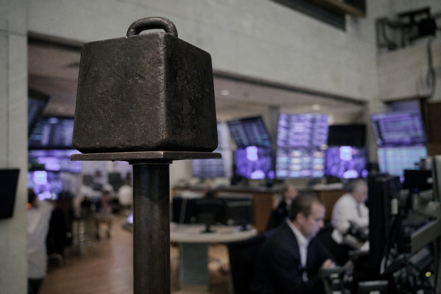A single large block balanced on a thin support, suggesting strain